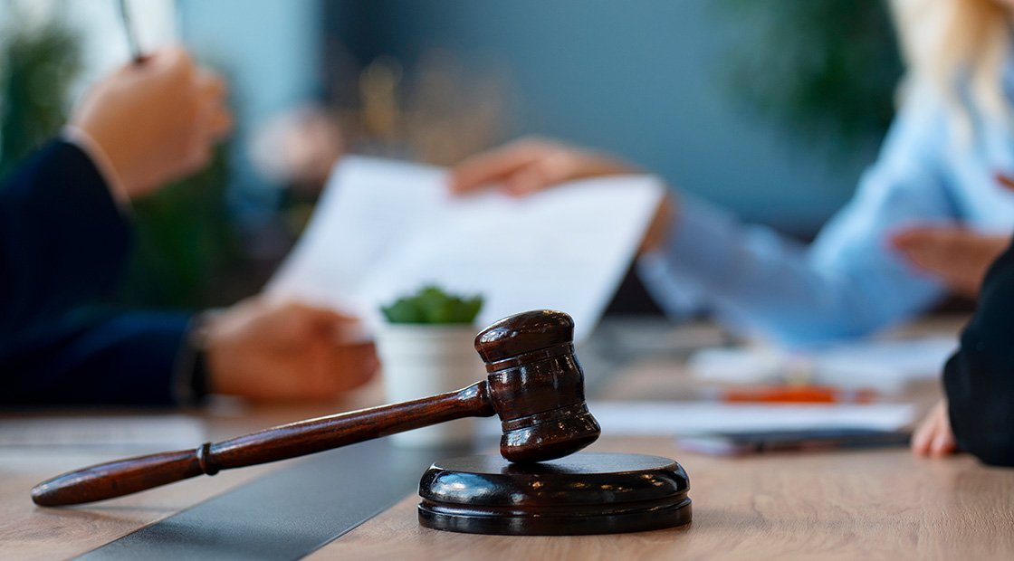 People with employment law document and gavel