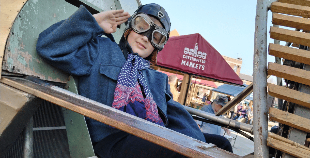 Boy saluting in a plane at Chesterfield 1940s Market
