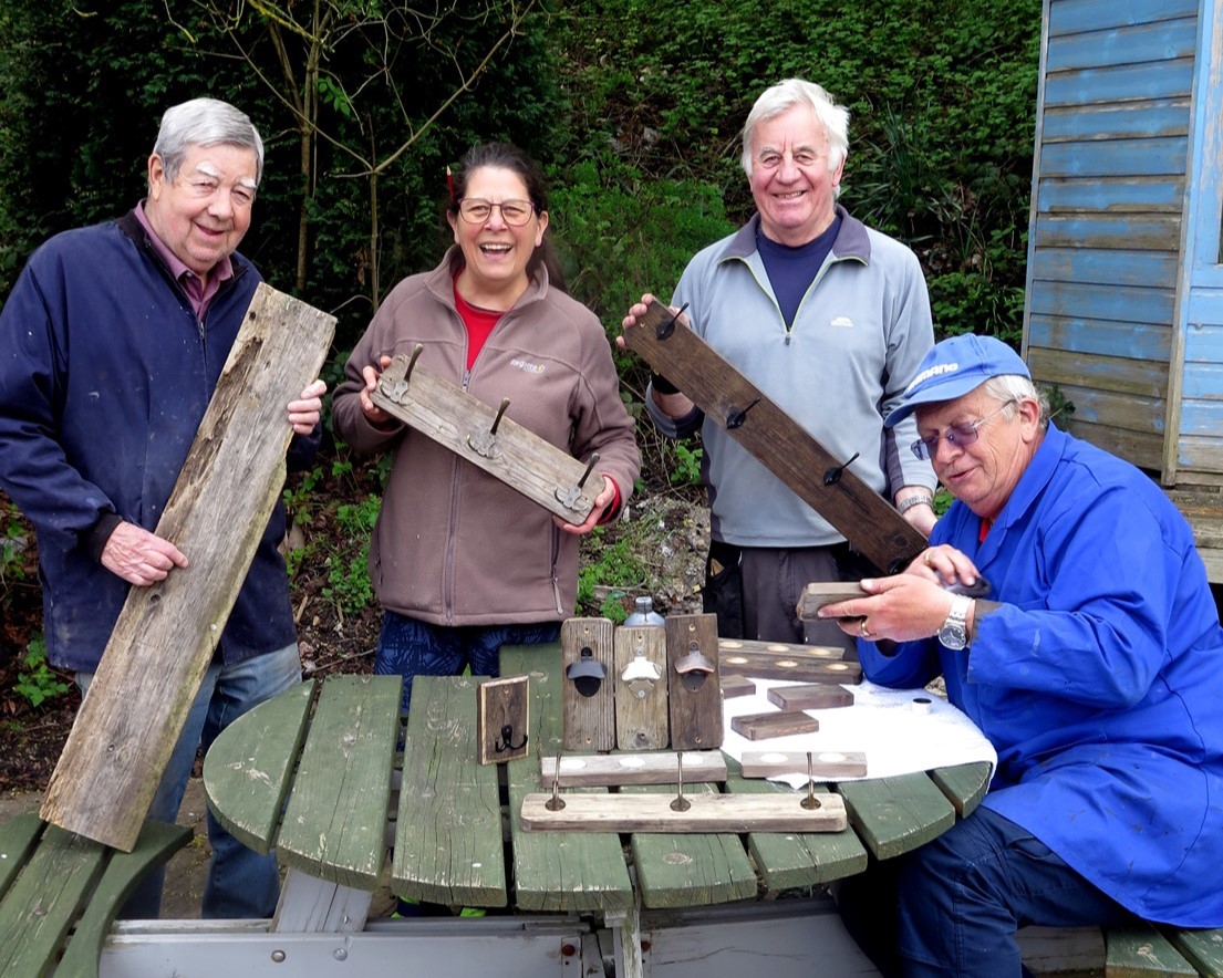 Members of the group showing their creations